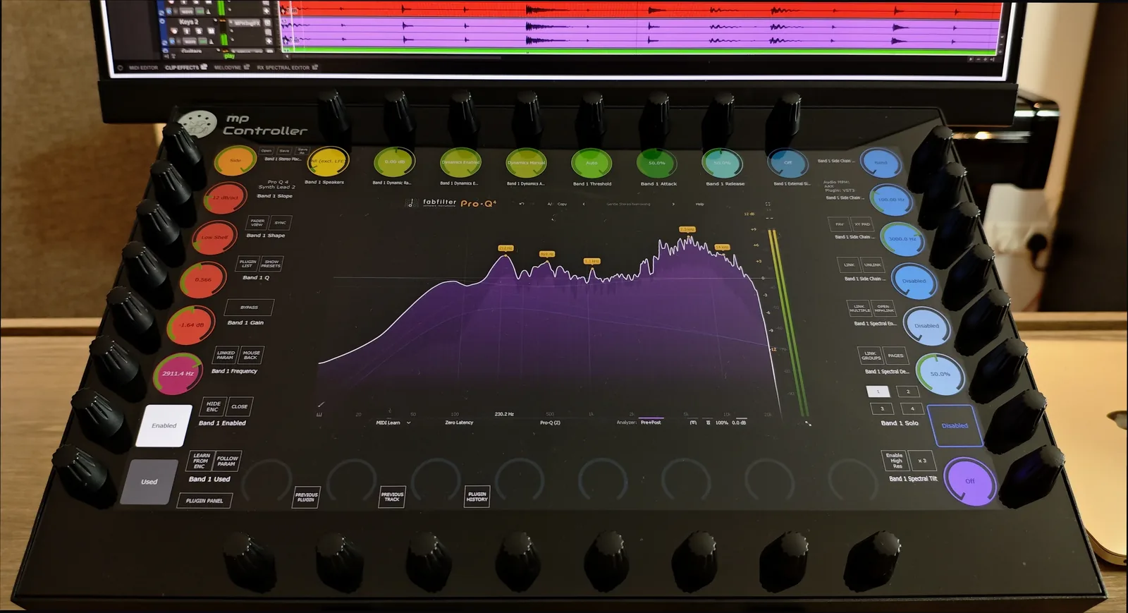 FabFilter Pro-Q 4 EQ curve and spectrum analyzer on the MP Controller's touchscreen with frequency, gain and Q on the endless encoders