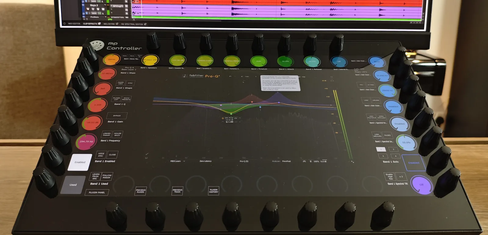 A FabFilter Pro-Q 4 band selected on the MP Controller touchscreen, mid/side and dynamic controls mapped across the endless encoders