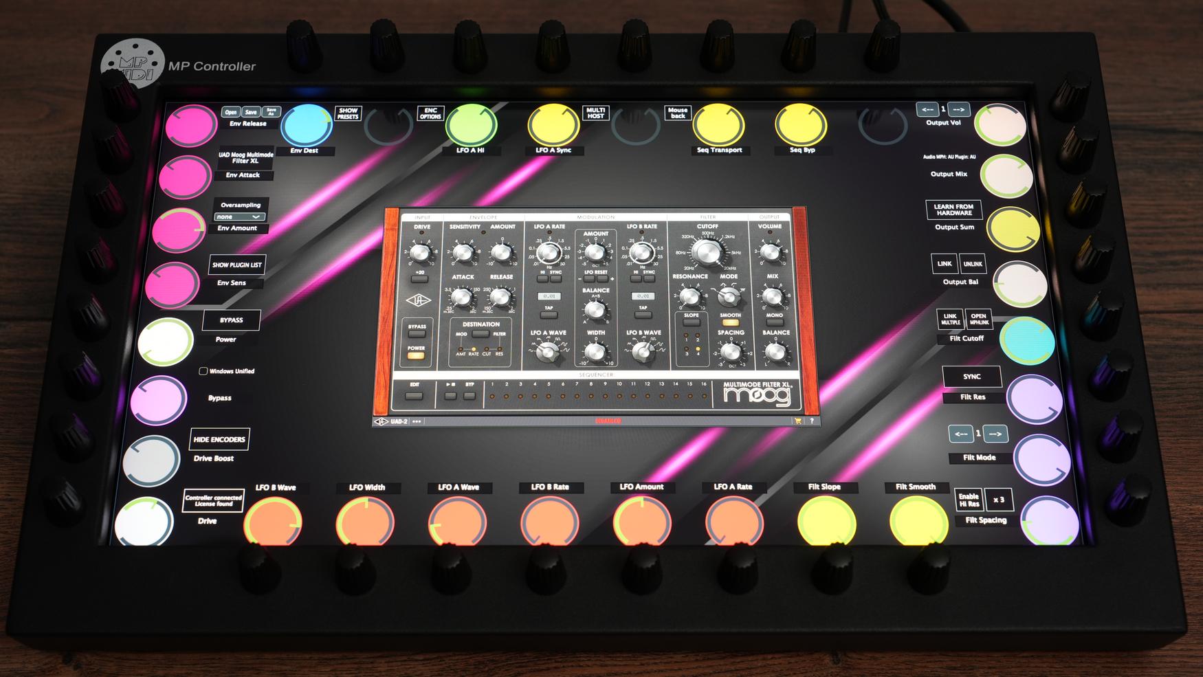MP MIDI Controller with Universal Audio UAD plugins showing touchscreen interface and 32 endless encoders